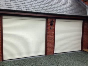 Two Aluroll insulated roller doors in white fitted in Whitchurch